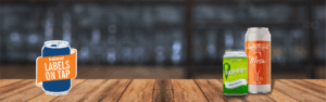 Photo of two beer cans on a bar