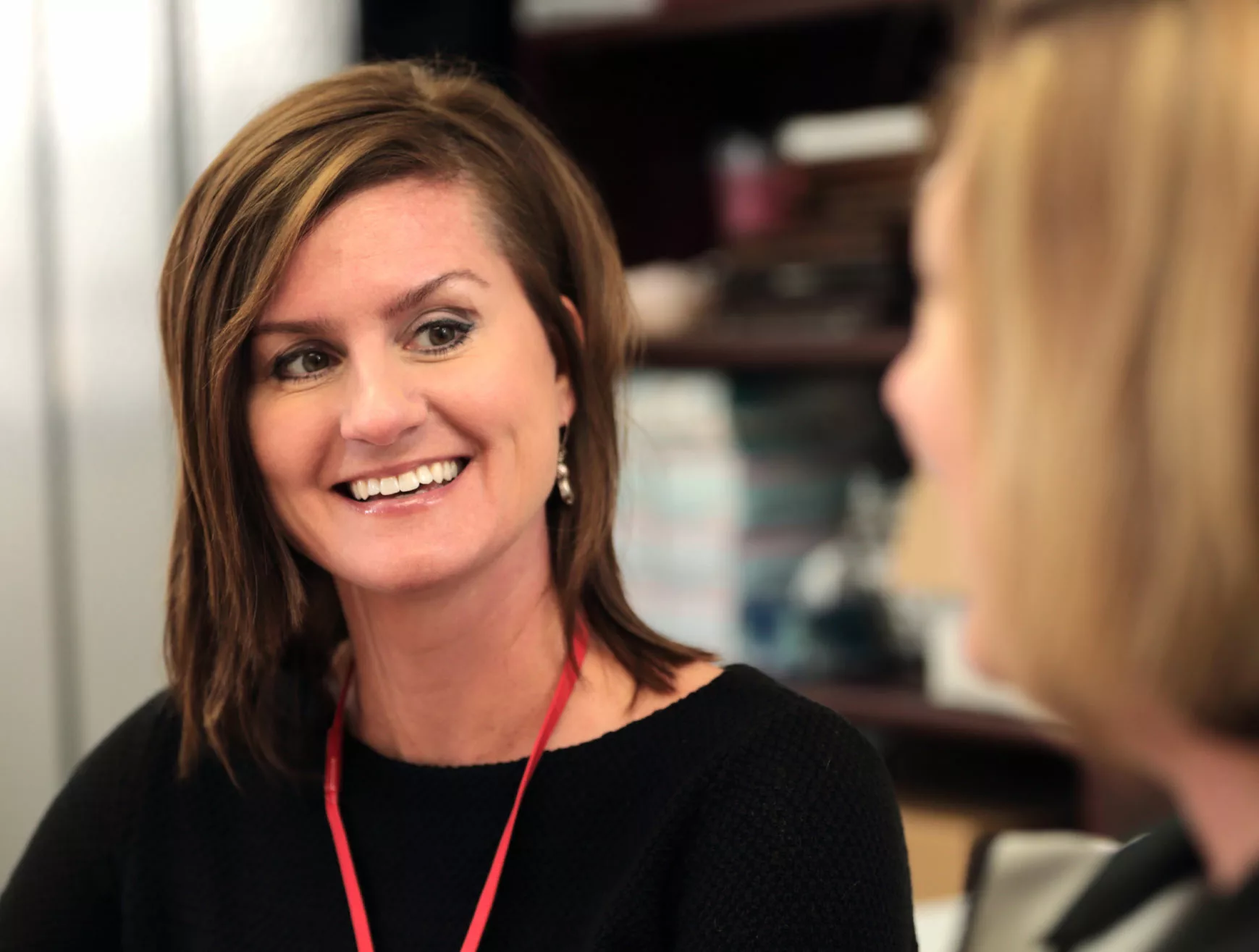 An Inland employee works with her team in the corporate office.