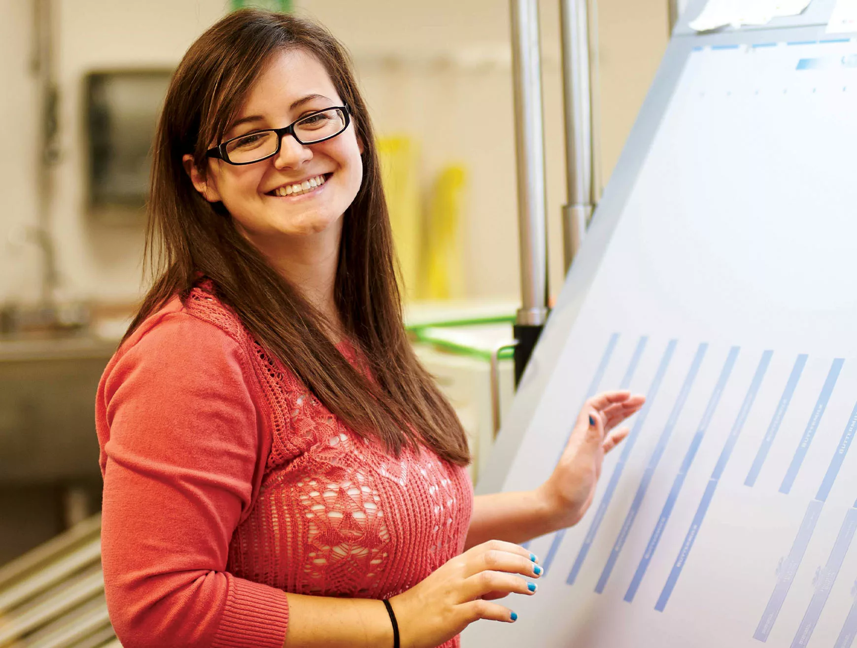 A female Inland employee works in the production facility.
