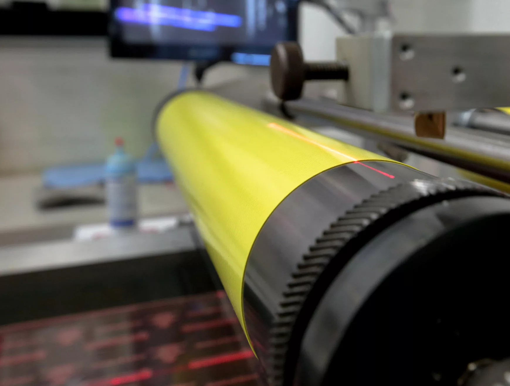 Side view of a photo print roller in the production facility.